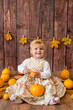 © capable97 - Little cute girl with orange pumpkins. Autumn mood. Halloween.