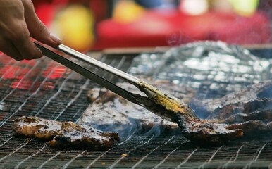 Poster - Piece of smoked meat on a barbecue grill