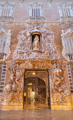 Fototapete - VALENCIA, SPAIN - FEBRUAR 14, 2022: The baroque facade of Palace - Palace of the Marques de Dos Aguas in alabaster by the Ignacio Vergara Gimeno (1715 - 13 1776)