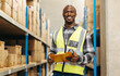 © Jacob Lund - Happy young warehouse worker smiling at the camera
