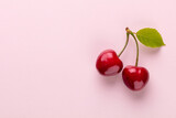 Fototapeta  - Cherry berries on a pastel background top view.  Background with a cherry on a sprig, flat lay