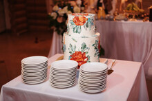 Festive Wedding White Cake With Tiers On The Table In The Restaurant