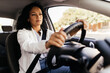 © kleberpicui - Young business woman driving her car in the city