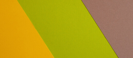 Wall Mural - Colorful paper texture background. Three color banner in yellow, green and brown