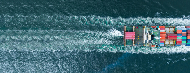 stern of Cargo container Ship in the ocean sea concept logistic transportation export to customs forwarding logistics service. Container on Bulk ship