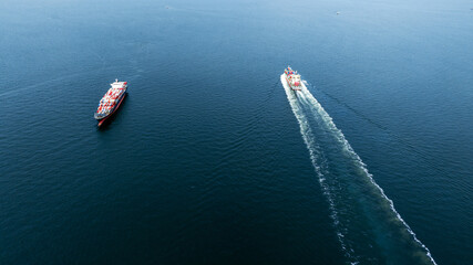 stern of cargo container ship in the ocean sea concept logistic transportation export to customs for