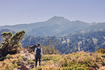 Man in a hat hiking in the mountains