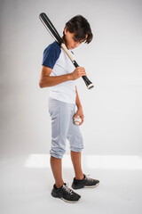 Wall Mural - Teenage baseball player sadly looking down at the ground after losing a game