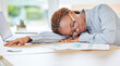 © Anela R/peopleimages.com - Sleeping, tired or burnout black woman in finance office with desk laptop or infographic documents. Exhausted, overworked or depression for accounting compliance employee in financial audit business