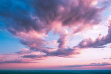 Poster - Colorful cloudy sky at sunset. Gradient color. Sky texture. Abstract nature background