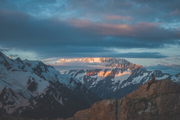  Hipster man watching sunrise at Mount Cook, New Zealand