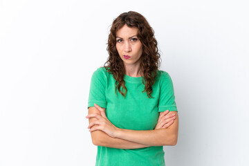 Wall Mural - Young woman with curly hair isolated on white background with unhappy expression