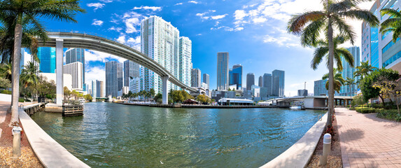 Wall Mural - Miami downtown skyline and futuristic mover train above Miami river panoramic view