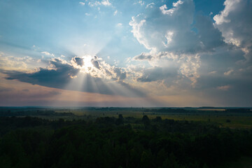 sun rays through dark clouds