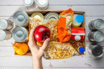 Wall Mural - Help Collection Center, Free Food Distribution. Volunteering, food donation box grocery set for in-need people