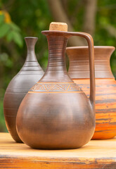 ceramic wine jug with a cork on table