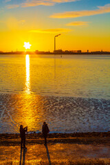 Wall Mural - Beautiful colorful golden sunset North Sea coast Bremerhaven to Nordenham.