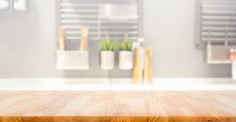 Wall Mural - Selective focus.Wood table top on blur kitchen counter background.