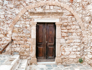 Wooden doorway to stone building in Monemvasia, Greece