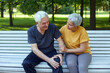 © Alex Tihonov - Elderly man got injured knee during stroll with wife outdoor