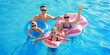 © Pixel-Shot - Happy family swimming in pool on summer day
