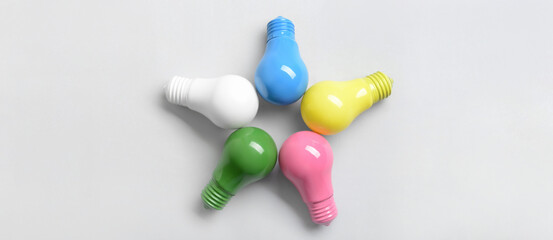 Wall Mural - Different light bulbs on white background, top view