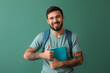 © Pixel-Shot - Handsome tattooed student showing thumb-up on green background