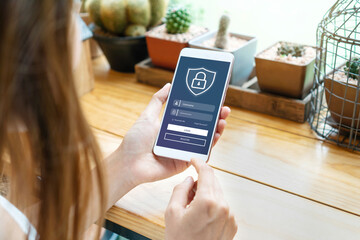 woman hand enter username and password to login on mobile phone screen. data protection and secured 