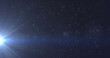 Leinwandbild Motiv Image of glowing blue light moving over spots of light and stars in background