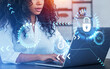 © ImageFlow - African businesswoman using laptop, padlock hud with lines and arrows