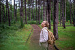 © olezzo - Beautiful happy caucasian active senior woman enjoying nature in autumn park. Active pensioners lifestyle concept
