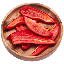 Sliced Red Pepper In Wooden Bowl Isolated