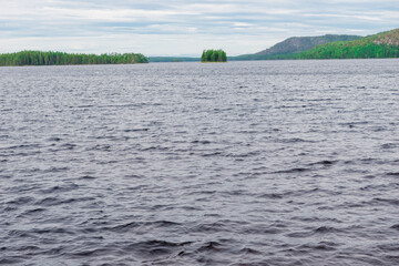 Wall Mural - Panorama of the lake before the rain. Thunderclouds over the lake