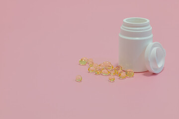 white plastic bottle with gel tablets. vitamins, drugs, dietary supplements. colorful background