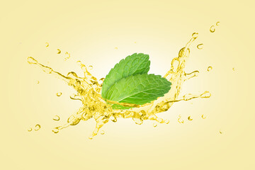 Wall Mural - Mint oil splash with fresh spearmint leaf isolated on yellow background.