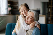 © Prostock-studio - Satisfied small granddaughter and european aged grandmother hugging, have fun together enjoy tender moment