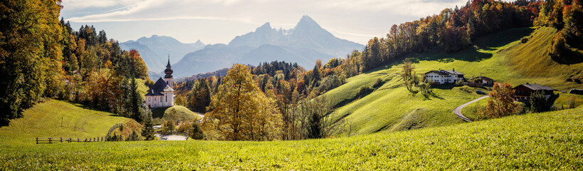 Aufkleber - Beautiful nature landscape. Incredible autumn scenery. View on Alpine highlands with Watzmann mount, colorful trees and Small church. Famous Maria Gern Church. Berchtesgaden Bavaria Alps Germany