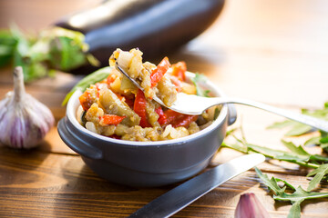 Wall Mural - eggplant fried sauteed with other vegetables in a plate