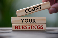 Count Your Blessings Text On Wooden Blocks With Blurred Park Background. Blessing Concept