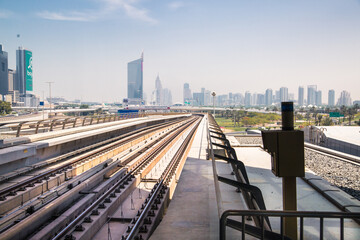 Dubai, UAE.  Dubai tube,  metro railway track view with City buildings