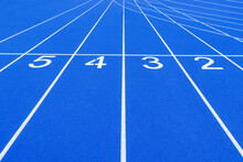 Blue Track And Field Lanes And Numbers. Running Lanes At A Track And Field Athletic Center. Horizontal Sport Theme Poster, Greeting Cards, Headers, Website And App