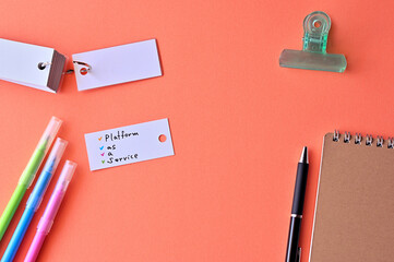 Poster - There is word card with the word Platform as a Service on the desk.