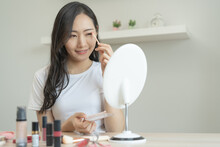 Daily Makeup Routine, Asian Young Women Looks In The Mirror During Putting Eyeshadow On Her Eyes.