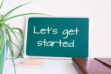 Wall Mural - Text Let's get started written on the green chalkboard
