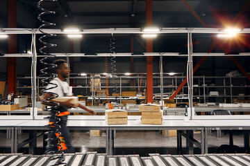 Wall Mural - african factory worker delivering box at the storage