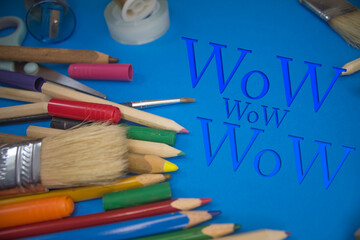 Poster - Overhead shot of school supplies with Wow text. Brushes, pencils, artistic tools. Art And Craft Work Tools.