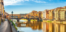 Panorama Of Beautiful Medieval Bridge Ponte Vecchio Over Arno River, Florence, Italy. Architecture And Landmark Of Florence. Travel Concept Background.