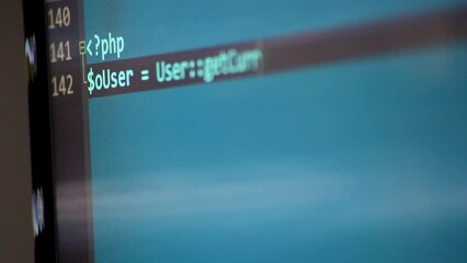 typing php-code on screen by web developer and php developer shows computer screen with source code 