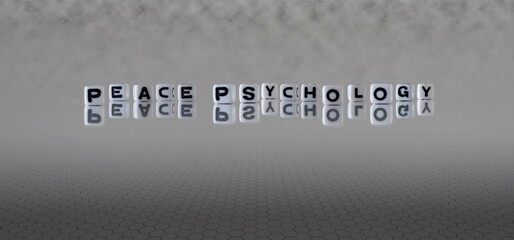 Sticker - peace psychology word or concept represented by black and white letter cubes on a grey horizon background stretching to infinity