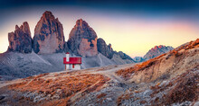 Small Chapel Against Tre Cime Di Lavaredo Peaks. Stunning Evening Scene Of Dolomite Alps, Italy, Europe. Traveling Concept Background.
